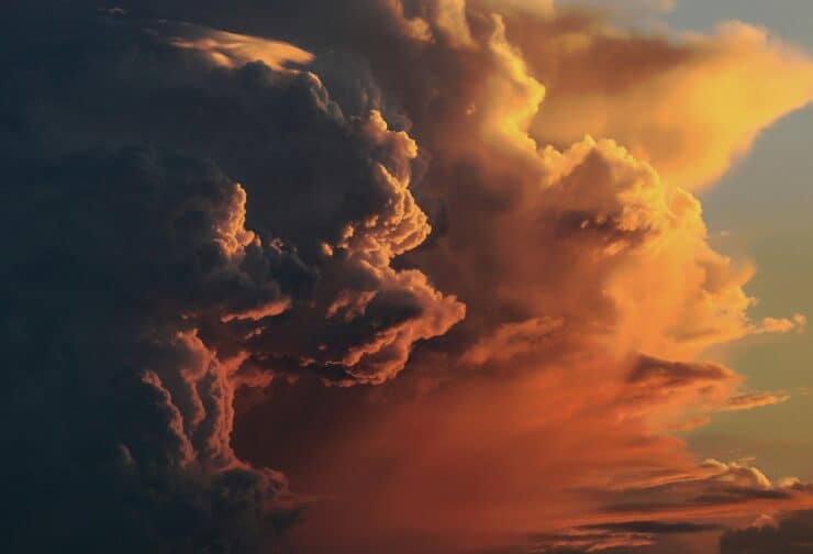 Stormy dark red sunset clouds; cover image for blog on 10 ways to improve employee retention.