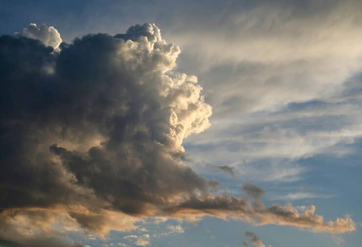 Stormy cloud against a blue sky; cover image for blog on how leadership development programs can be used to improve performance management.